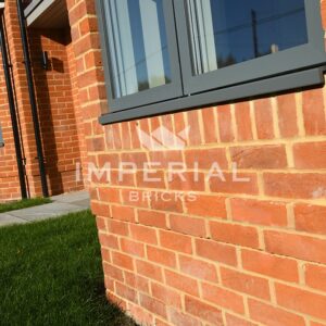 Angled close up of the Heritage Soft Orange brickwork used to build a detached new build home.