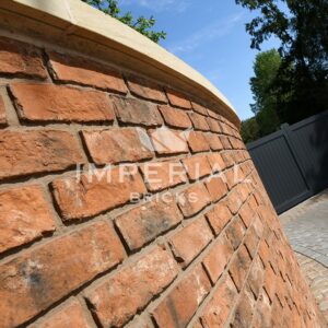 Close up of brickwork in a curved wall using Reclamation Shire Blend bricks.
