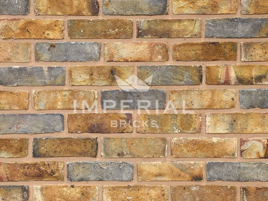 Weathered original London stock bricks shown in a wall.