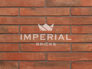 Soft Red Multi Linear bricks shown in a wall. The bricks have red shade variations.