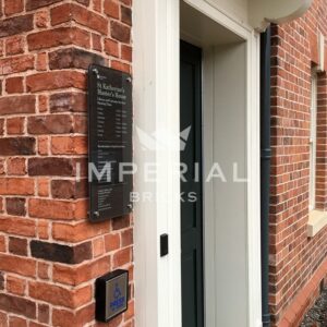 Close up, angled view of the entrance to Master's House in Ledbury, built using County Blend handmade bricks and laid in a flemish brick bond.