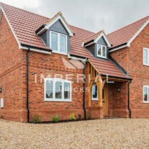 Detached self build home built using Country Blend handmade bricks, finished with oak frame entracne and traditional style windows.
