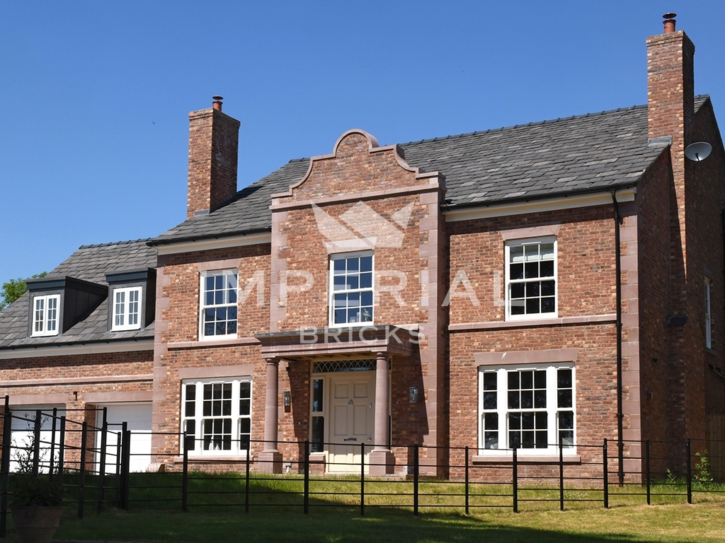 Large detached Georgian style new build home, built using Reclamation Red Handmade bricks with red quoin detailing.